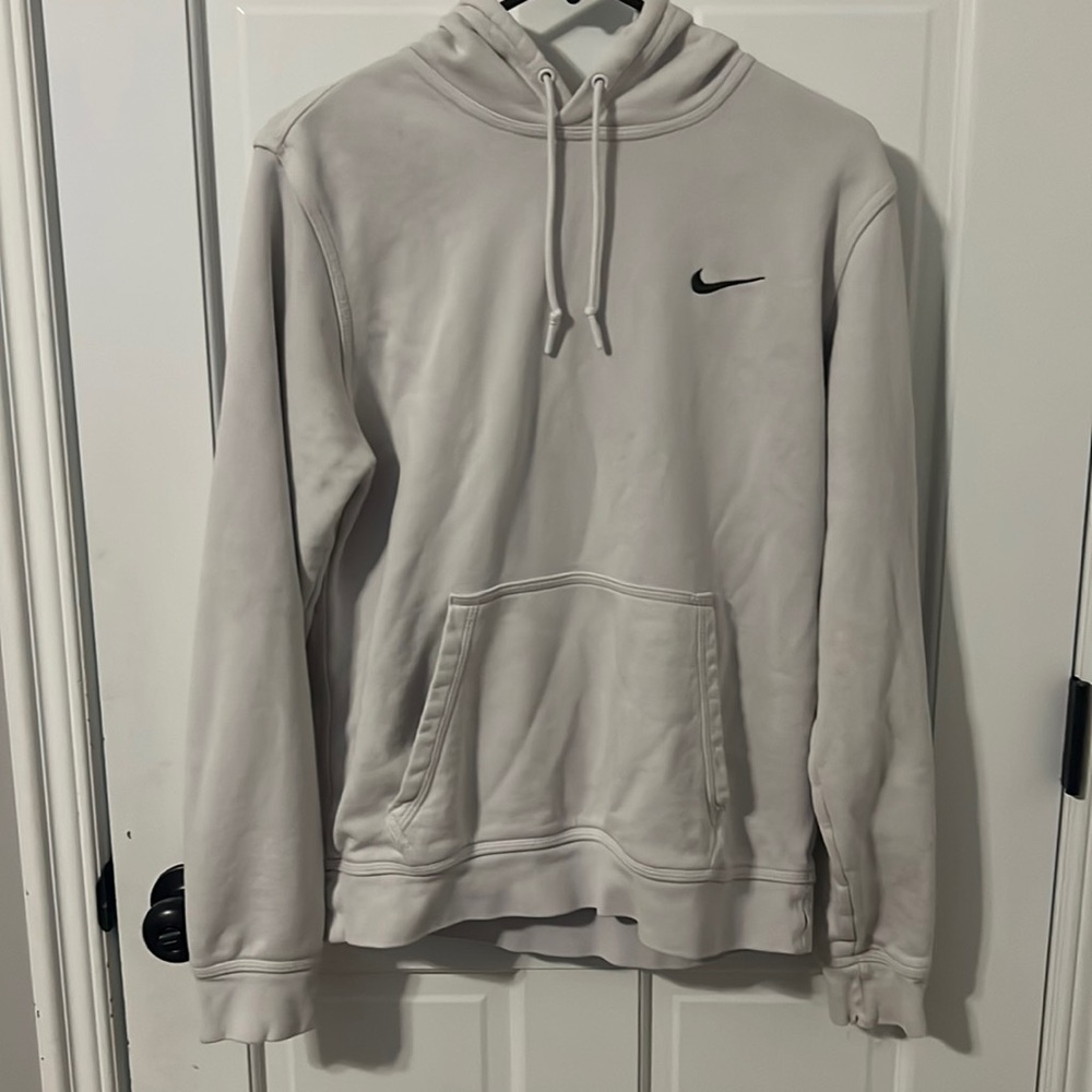 Plain white hoodie with an embroidered swoosh